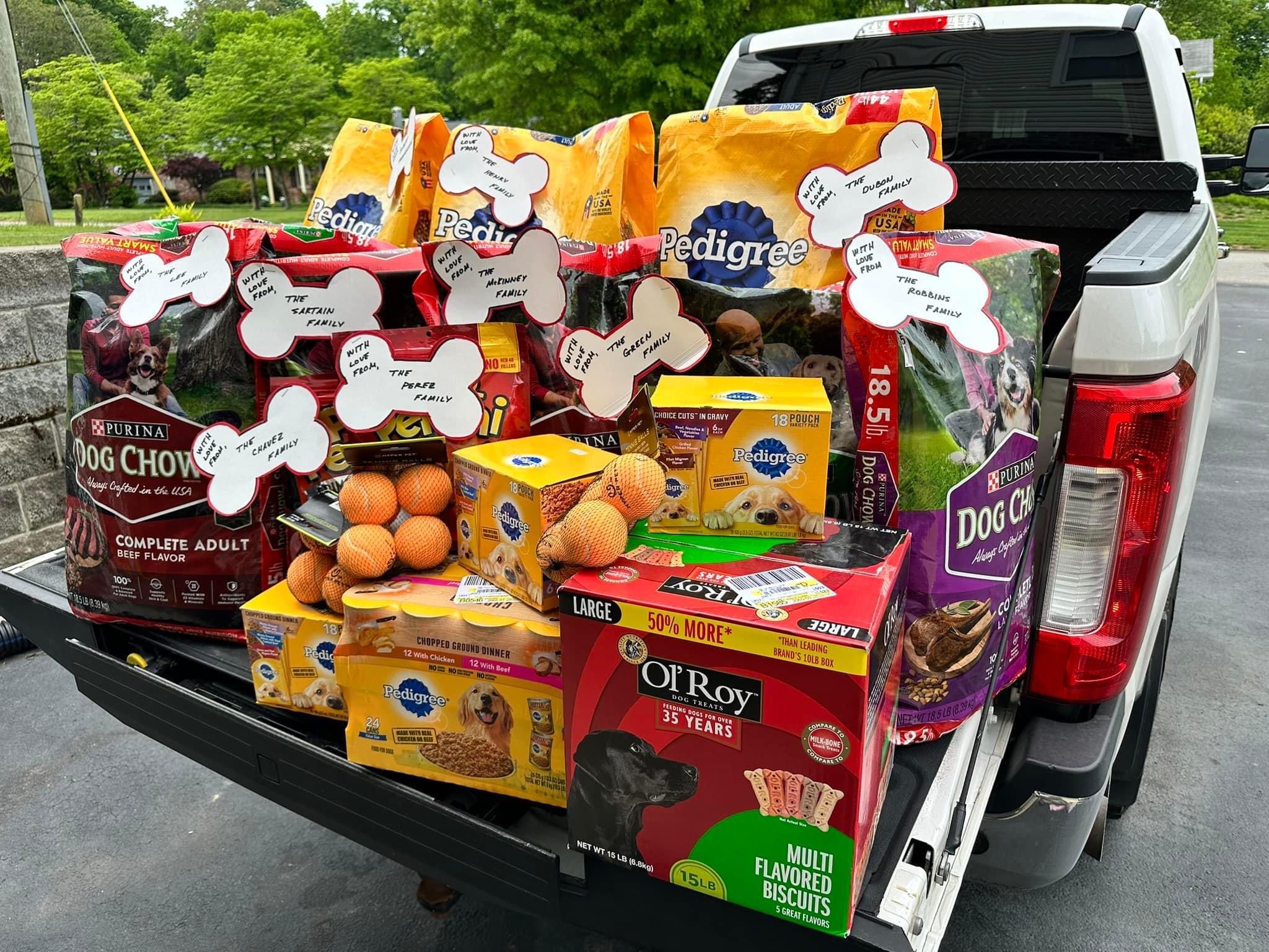 rescue roofing donates dog food to local shelters